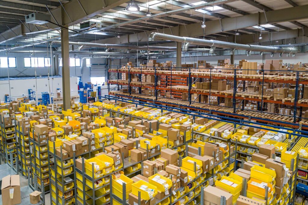 Overlooking inside a warehouse with racks full of boxes